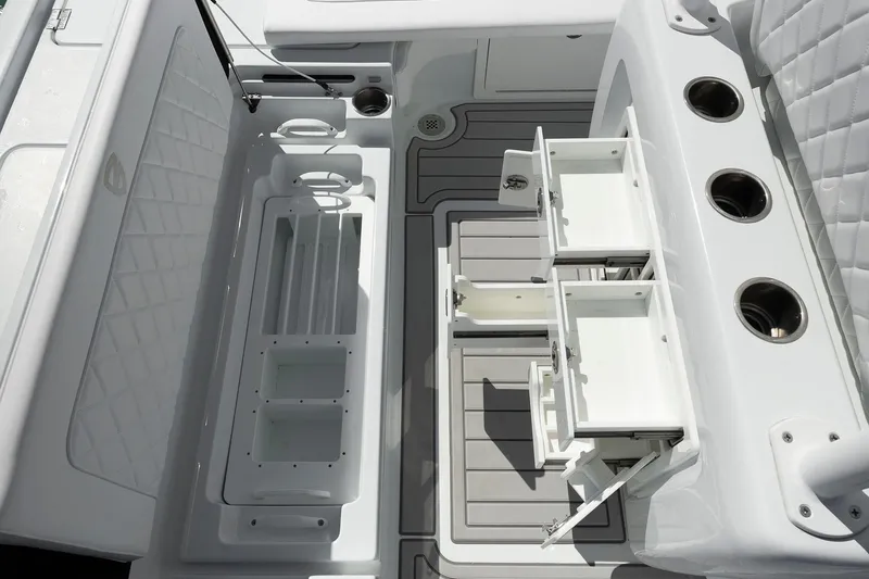  Yacht Photos Pics 2026 Barker Boatworks 26 Calibogue Bay interior with storage compartments and rod holders.