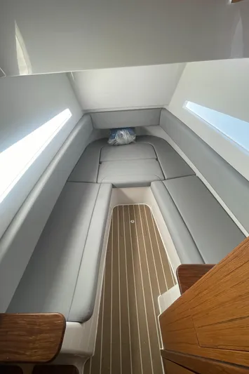  Yacht Photos Pics Interior cabin of 2023 Jupiter 40 boat with grey seating and wooden flooring.