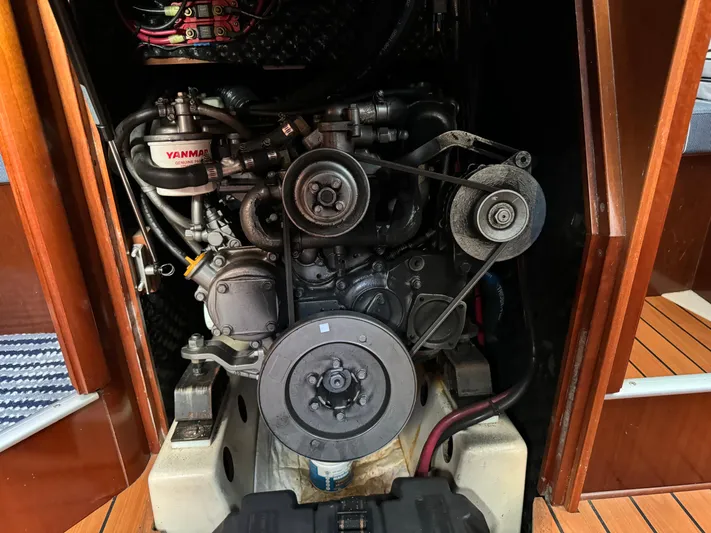 Interlude Yacht Photos Pics Engine compartment of a 2002 Beneteau 393 sailboat, featuring a Yanmar engine.