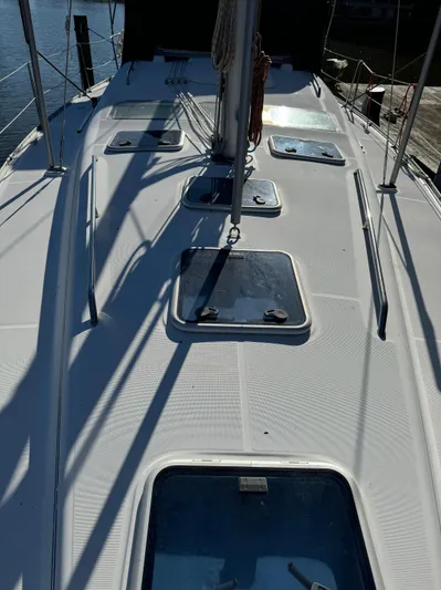 Interlude Yacht Photos Pics Deck view of a 2002 Beneteau 393 sailboat with multiple hatches.