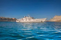 Luxury yacht "Custom Displacement Twin Screw" on clear blue water, 1982 model.