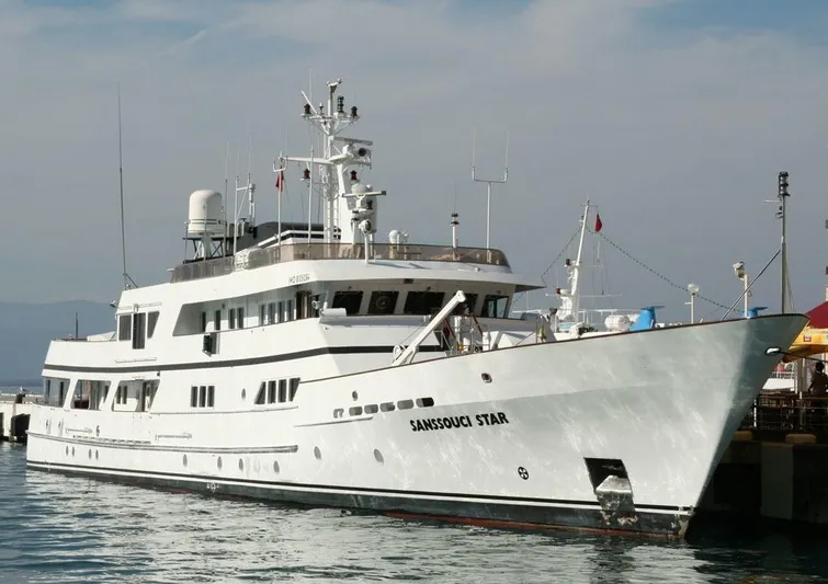 Sanssouci Star Yacht Photos Pics Custom 1982 Displacement Twin Screw yacht docked at a marina.