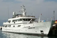 Custom 1982 Displacement Twin Screw yacht docked at a marina.