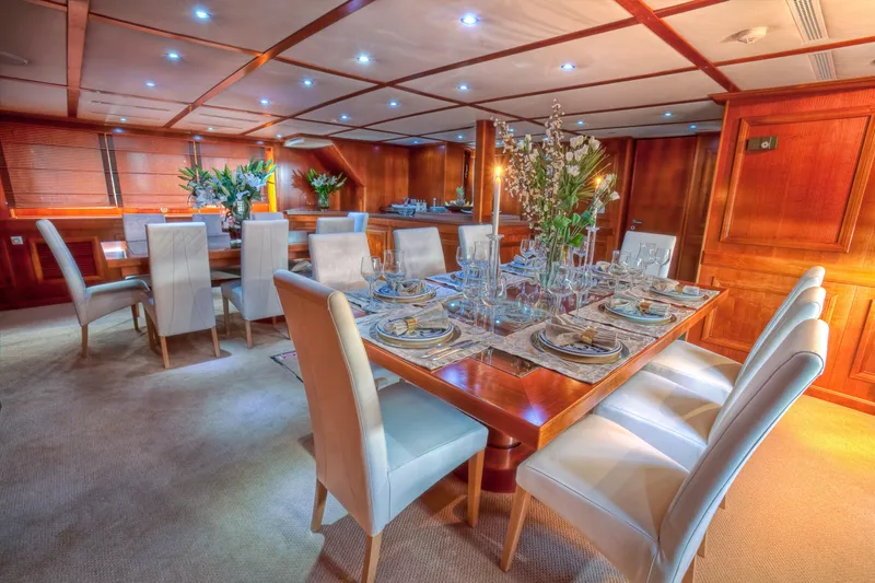 Sanssouci Star Yacht Photos Pics Luxurious yacht dining room with elegant table setting, Custom Displacement Twin Screw, 1982.