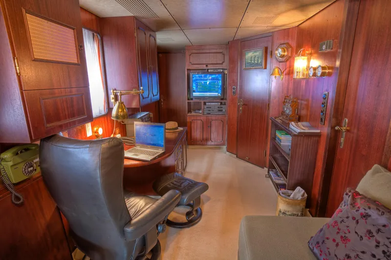 Sanssouci Star Yacht Photos Pics Luxurious 1982 Custom Displacement Twin Screw yacht interior with wood paneling and modern amenities.