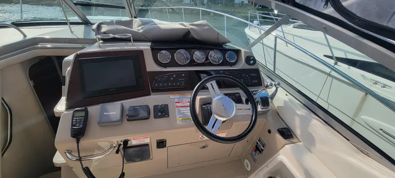  Yacht Photos Pics Helm of 2008 Sea Ray 350 Sundancer with steering wheel, gauges, and navigation equipment.
