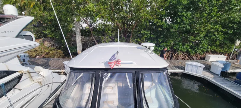  Yacht Photos Pics 2008 Sea Ray 350 Sundancer docked at a marina with an American flag.