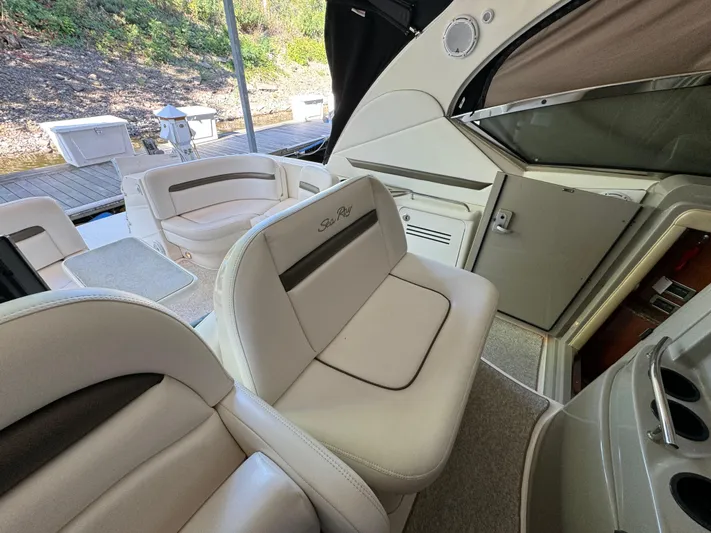 Knot Satisfied Yacht Photos Pics Interior of a 2006 Sea Ray 38 Sundancer boat with white leather seating.