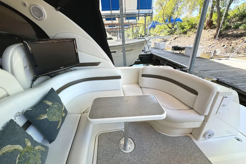 Knot Satisfied Yacht Photos Pics Luxurious 2006 Sea Ray 38 Sundancer yacht interior with plush seating and table.