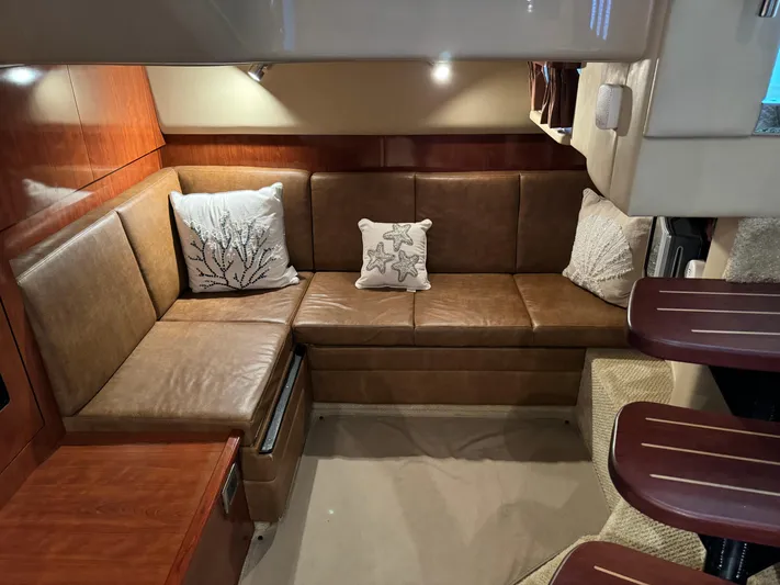 Knot Satisfied Yacht Photos Pics Interior of 2006 Sea Ray 38 Sundancer with leather seating and decorative pillows.