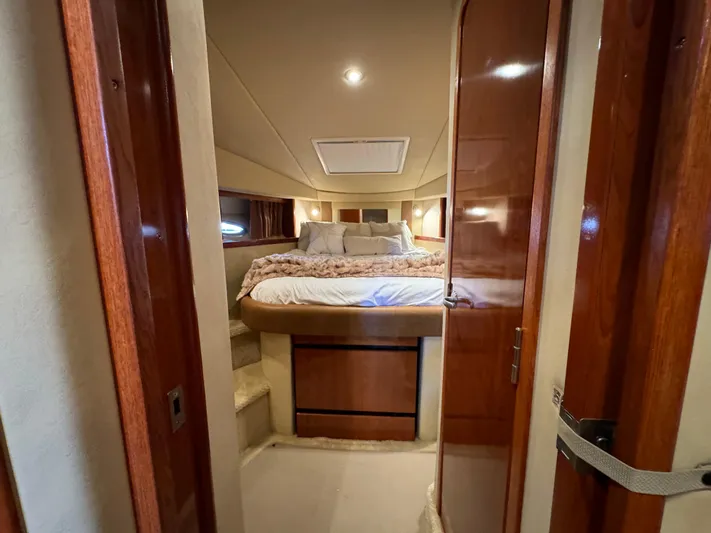 Knot Satisfied Yacht Photos Pics Luxurious cabin interior of 2006 Sea Ray 38 Sundancer yacht with cozy bed.