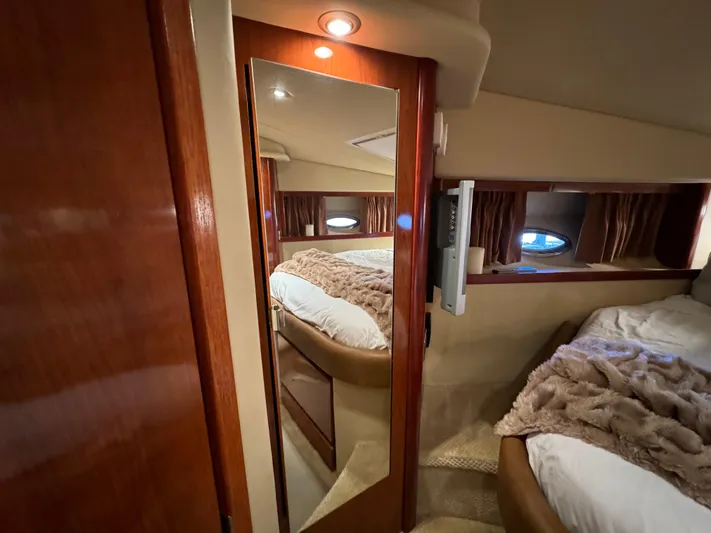Knot Satisfied Yacht Photos Pics Luxurious cabin interior of 2006 Sea Ray 38 Sundancer yacht with cozy bedding.