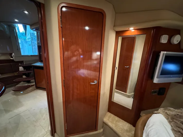 Knot Satisfied Yacht Photos Pics Interior of 2006 Sea Ray 38 Sundancer yacht with wooden door and mirror.