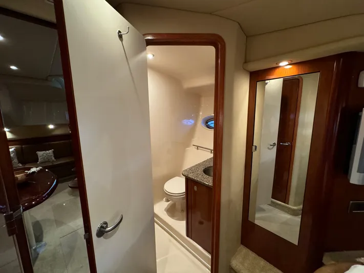 Knot Satisfied Yacht Photos Pics Interior of 2006 Sea Ray 38 Sundancer yacht showing bathroom and mirror.
