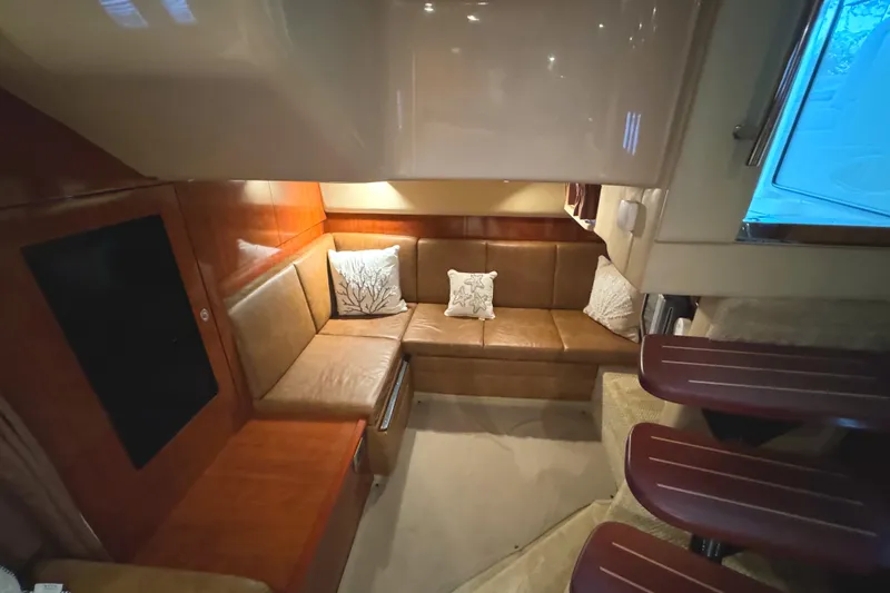 Knot Satisfied Yacht Photos Pics Interior of 2006 Sea Ray 38 Sundancer yacht with cozy seating area and cushions.