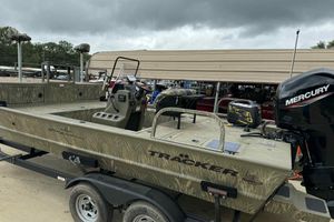 2022 Tracker Grizzly 2072 CC Sportsman boat with Mercury engine on trailer.