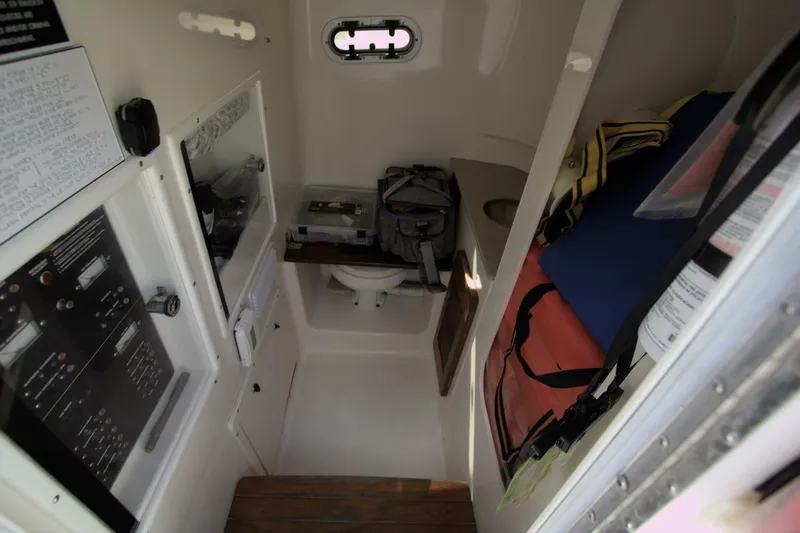  Yacht Photos Pics Interior of 2001 Pursuit 3070 Center Console boat with storage and control panels.