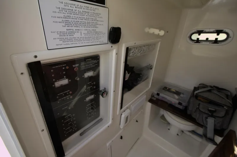  Yacht Photos Pics Interior of 2001 Pursuit 3070 Center Console boat with control panel and storage.