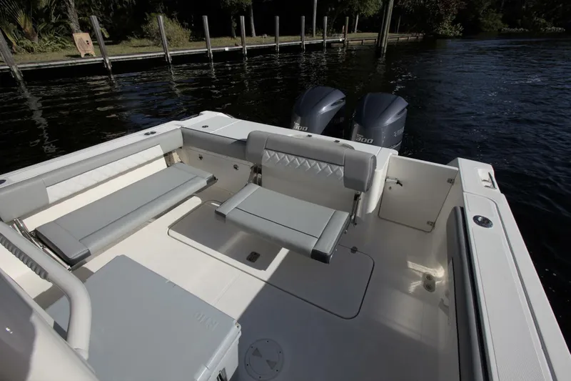  Yacht Photos Pics 2001 Pursuit 3070 Center Console boat interior with seating and dual engines.