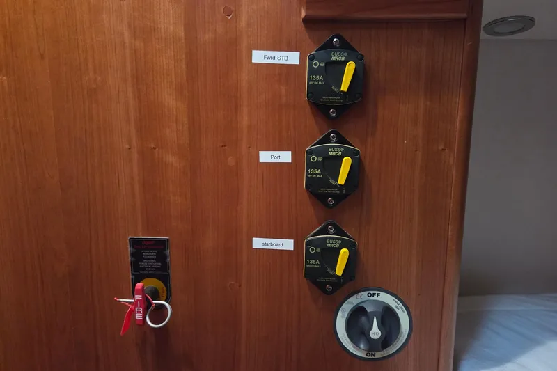 Bella Yacht Photos Pics Control panel on 2018 Tartan 4300 yacht with labeled switches and fire safety key.