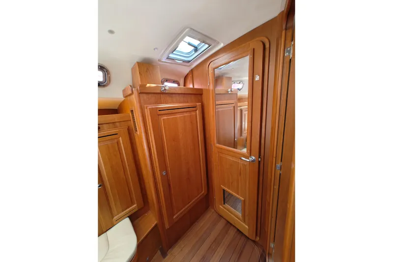 Bella Yacht Photos Pics Interior of 2018 Tartan 4300 yacht with wooden cabinetry and skylight.