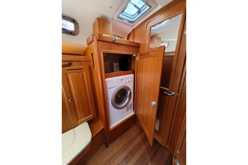 Bella Yacht Photos Pics Interior of 2018 Tartan 4300 yacht featuring a built-in washing machine.
