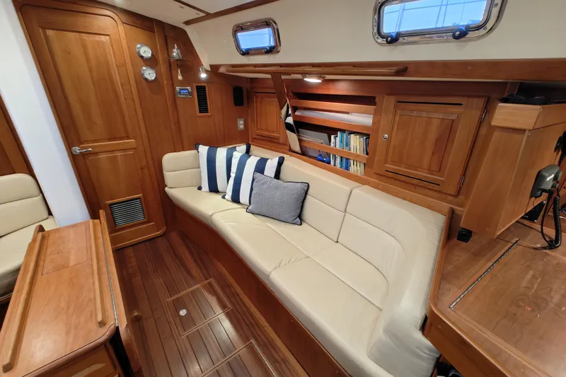 Bella Yacht Photos Pics Luxurious 2018 Tartan 4300 yacht interior with wooden cabinetry and comfortable seating.