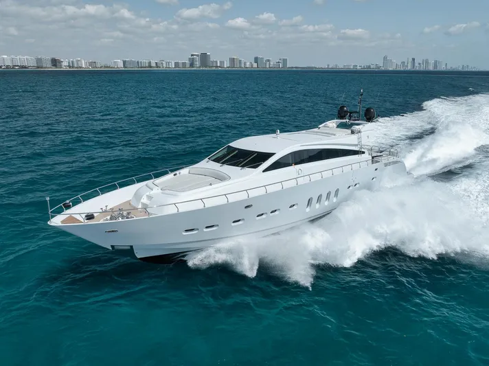 U Wish Yacht Photos Pics 2008 Arno Leopard Open Sport Yacht cruising on blue ocean near city skyline.
