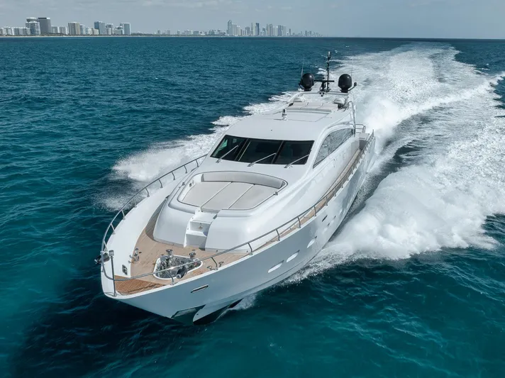 U Wish Yacht Photos Pics 2008 Arno Leopard Open Sport Yacht cruising on blue ocean near city skyline.