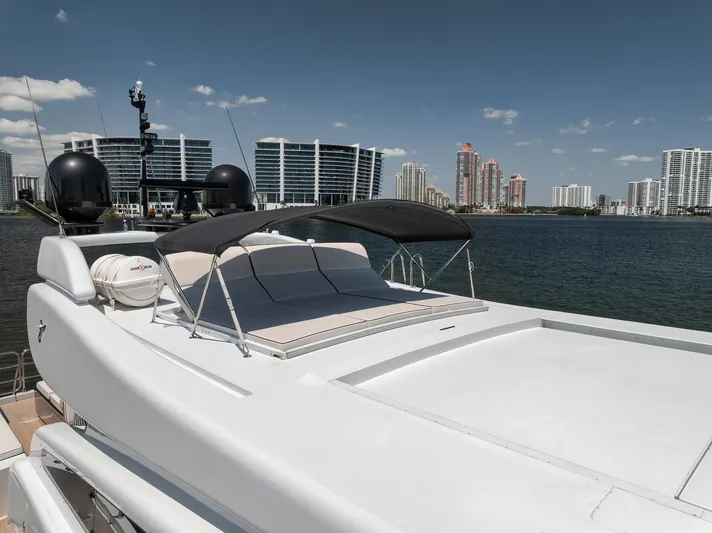 U Wish Yacht Photos Pics 2008 Arno Leopard Open Sport Yacht with sunbathing area, city skyline in background.