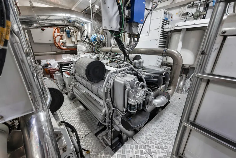 U Wish Yacht Photos Pics Engine room of 2008 Arno Leopard Open Sport Yacht, showcasing complex machinery and piping.