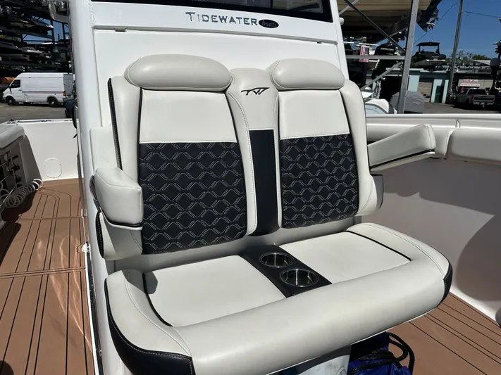  Yacht Photos Pics 2022 Tidewater 280 CC boat with stylish dual seats and cup holders.