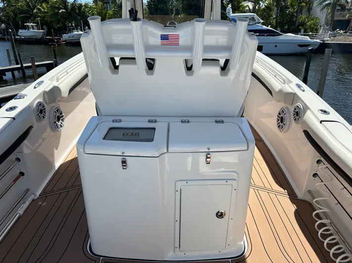  Yacht Photos Pics 2022 Tidewater 280 CC boat interior with fishing rod holders and storage compartments.