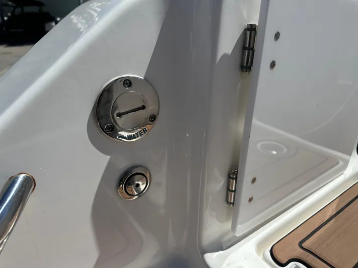  Yacht Photos Pics 2022 Tidewater 280 CC boat detail showing water inlet and hinge.