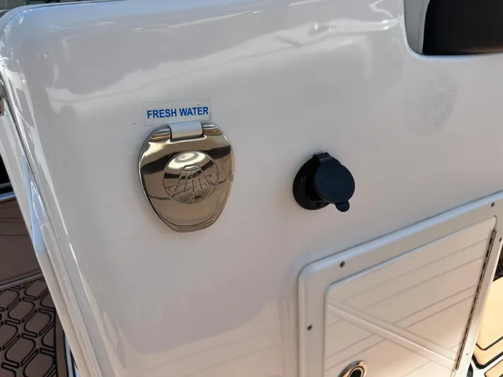  Yacht Photos Pics Tidewater 280 CC 2022 boat with fresh water access panel.