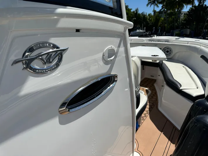  Yacht Photos Pics 2022 Tidewater 280 CC boat interior with seating and logo detail.