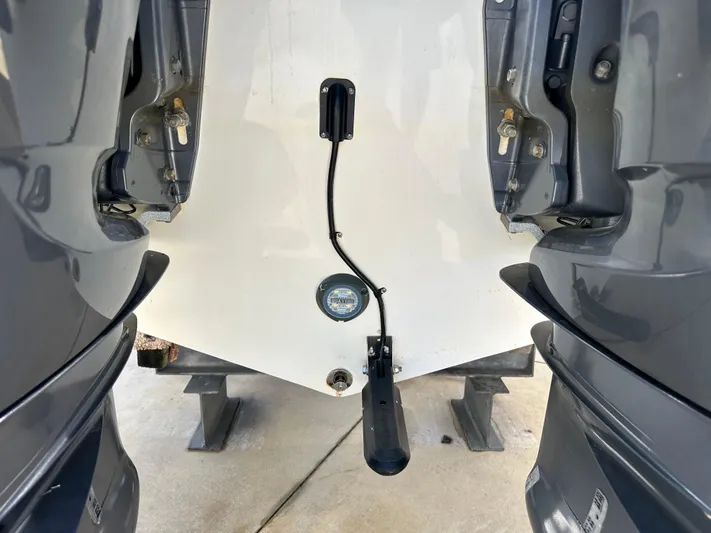  Yacht Photos Pics Rear view of 2022 Tidewater 280 CC boat with dual outboard motors.