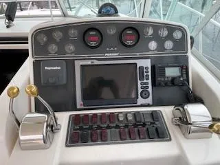 Pathological Yacht Photos Pics Control panel of a 2000 Pursuit 3400 Express boat with navigation instruments.