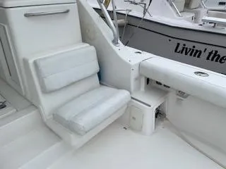 Pathological Yacht Photos Pics 2000 Pursuit 3400 Express boat interior with cushioned seating and storage.