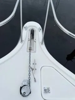 Pathological Yacht Photos Pics Bow of 2000 Pursuit 3400 Express boat with anchor chain and railing.