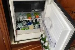 Pathological Yacht Photos Pics Open fridge on 2000 Pursuit 3400 Express boat, stocked with drinks and condiments.