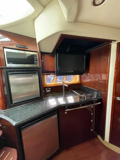 Konichiwa Yacht Photos Pics 2010 Sea Ray 390 Sundancer kitchen with modern appliances and sleek design.