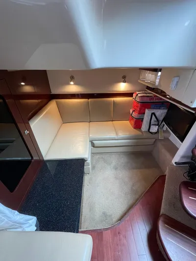 Konichiwa Yacht Photos Pics Interior of 2010 Sea Ray 390 Sundancer with beige seating and wooden flooring.