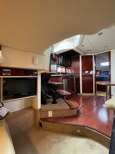 Konichiwa Yacht Photos Pics Interior of 2010 Sea Ray 390 Sundancer yacht with modern kitchen and wooden flooring.