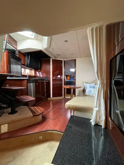 Konichiwa Yacht Photos Pics Interior of 2010 Sea Ray 390 Sundancer yacht with modern kitchen and seating area.