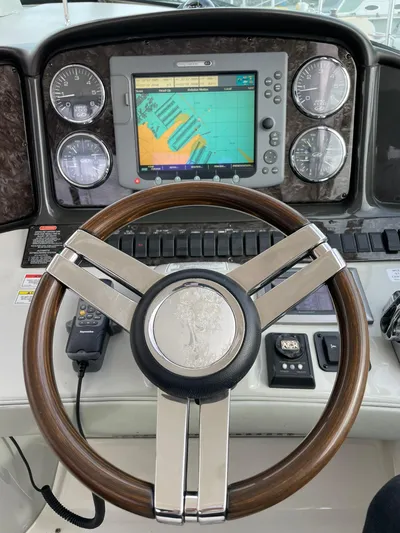 Konichiwa Yacht Photos Pics Steering wheel and navigation system of a 2010 Sea Ray 390 Sundancer boat.