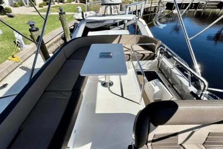  Yacht Photos Pics 2017 Galeon 380 Fly yacht with spacious deck and seating area by the water.