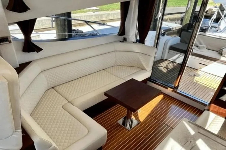  Yacht Photos Pics Luxurious interior of 2017 Galeon 380 Fly yacht with elegant seating and wooden flooring.
