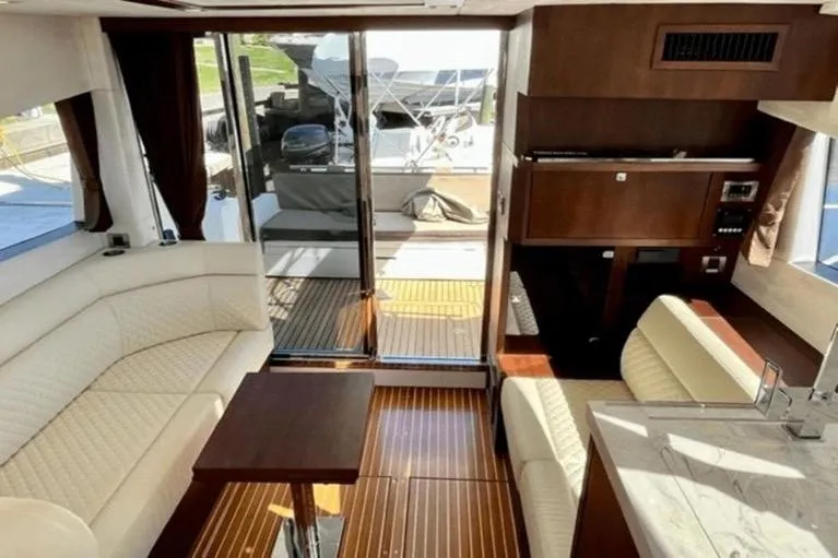  Yacht Photos Pics Luxurious interior of 2017 Galeon 380 Fly yacht with elegant seating and wooden finishes.