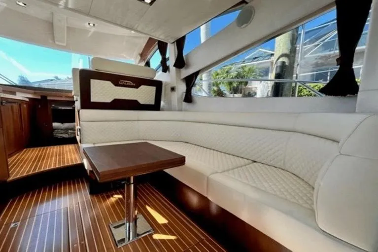  Yacht Photos Pics Luxurious interior of 2017 Galeon 380 Fly yacht with elegant seating and wooden flooring.